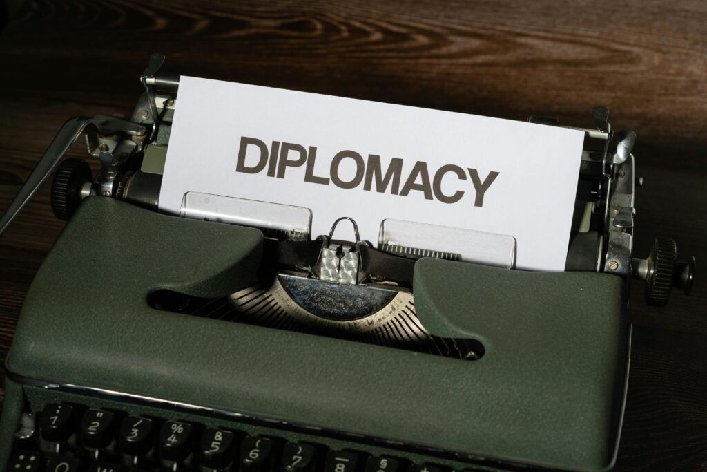 Close-up of a vintage typewriter with the word 'Diplomacy' on a paper sheet.